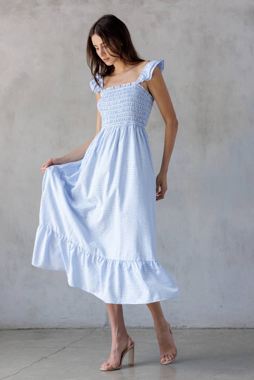A BLUE GINGHAM SMOCKED BODICE MIDI DRESS